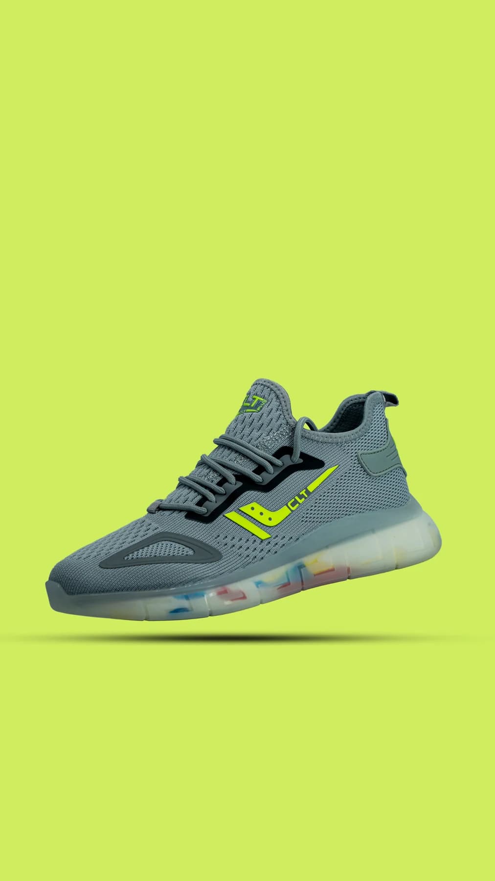 Gray sneaker against a bright lime background