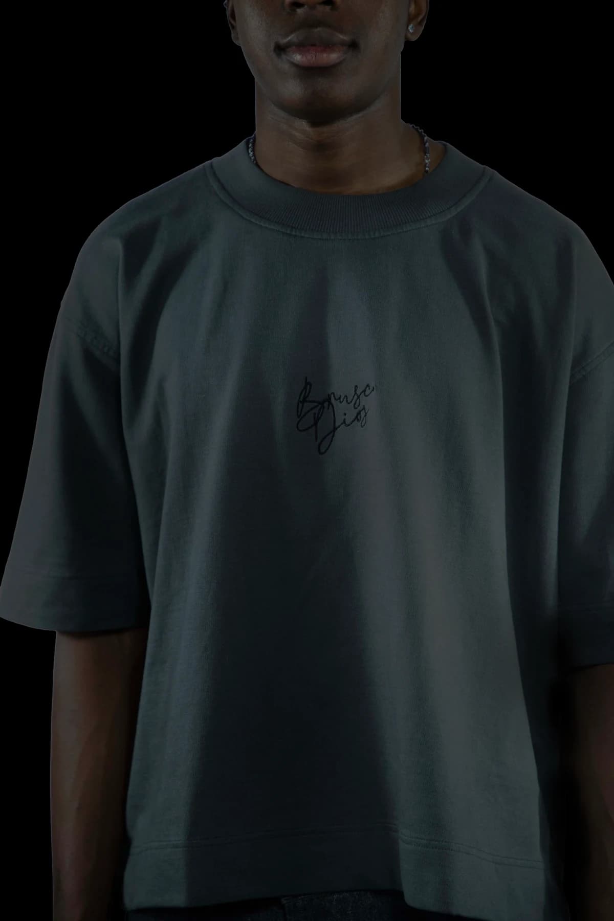 Close-up of a graphic on a dark T-shirt